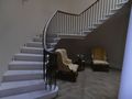 curved wreath handrail on wrought iron and cantilevered stone staircase 1